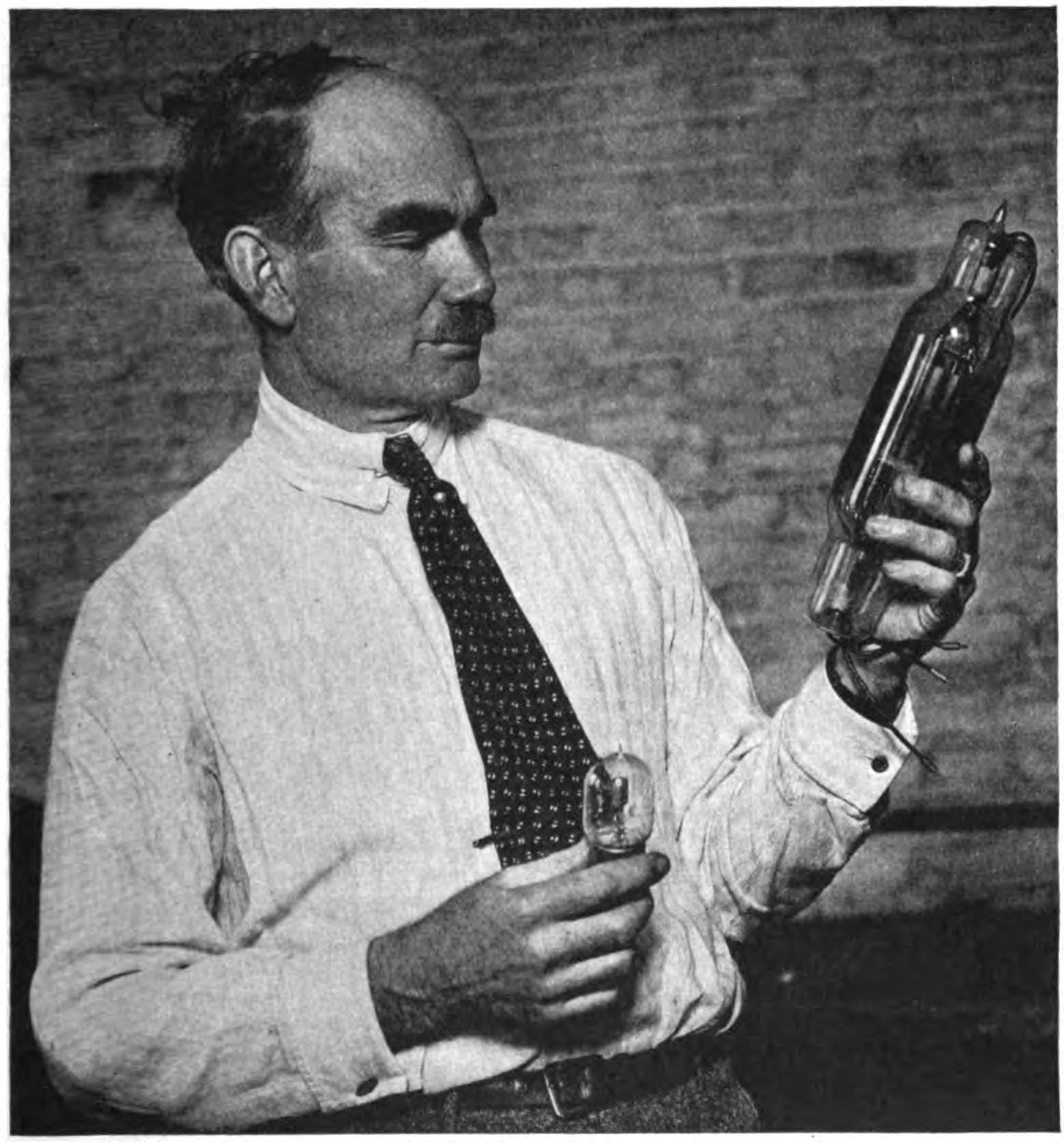 Lee De Forest with Audion tubes. https://commons.wikimedia.org/wiki/File:Lee_De_Forest_with_Audion_tubes.jpg